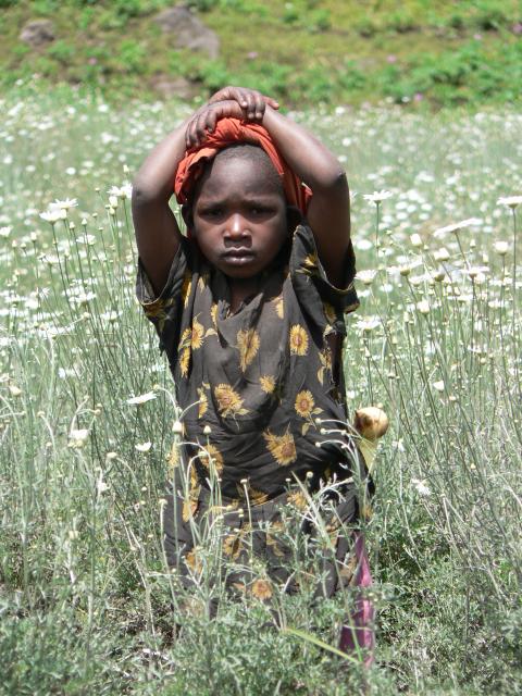 Rwanda child in field